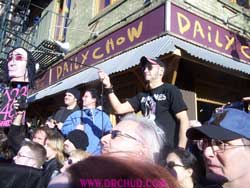 Arturo attends to his post and waits for the right time to pull the string that's attached to the t-shirt! 